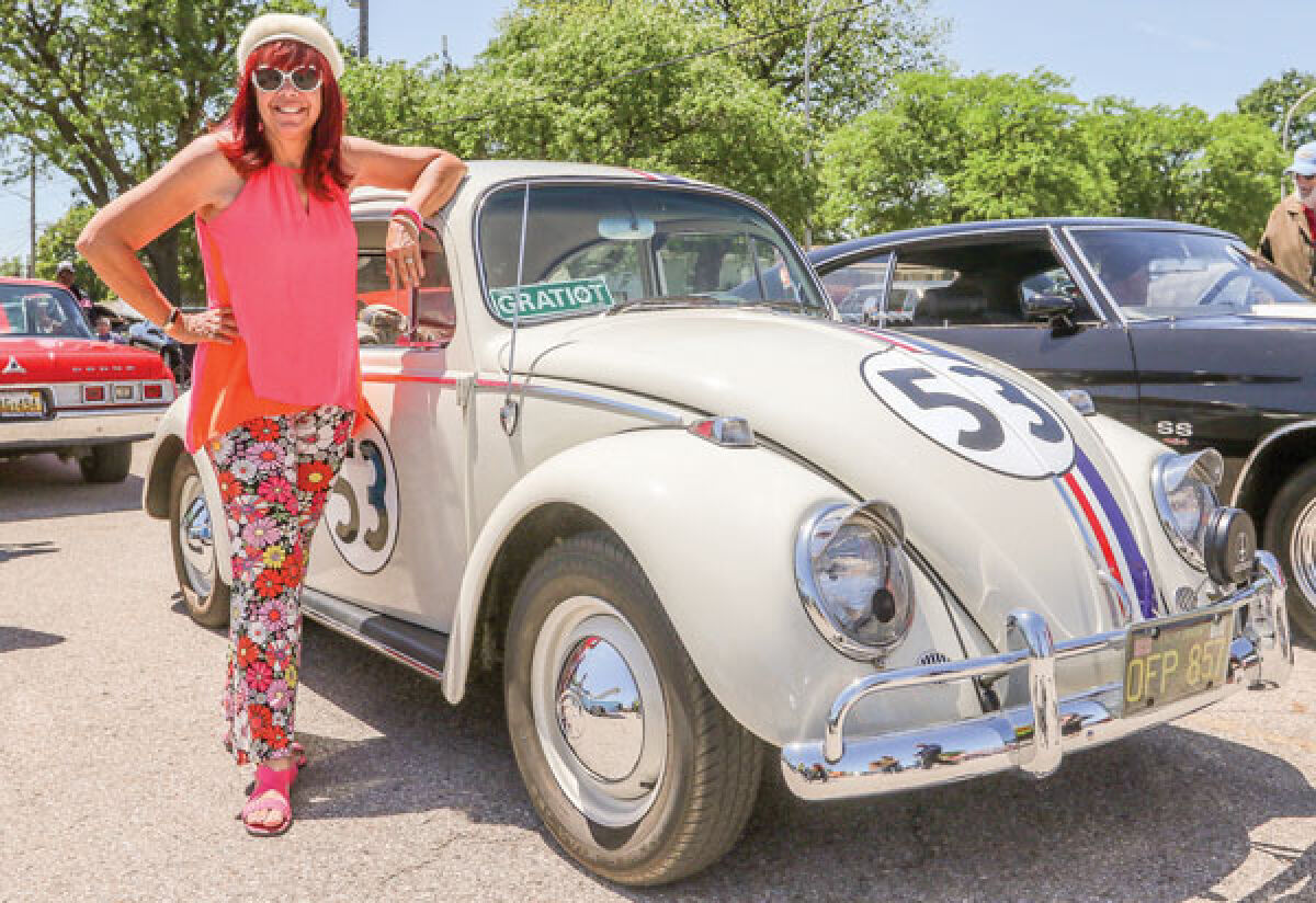 Lynn Anderson, of Clinton Township, and her 1965 Volkswagen Beetle.